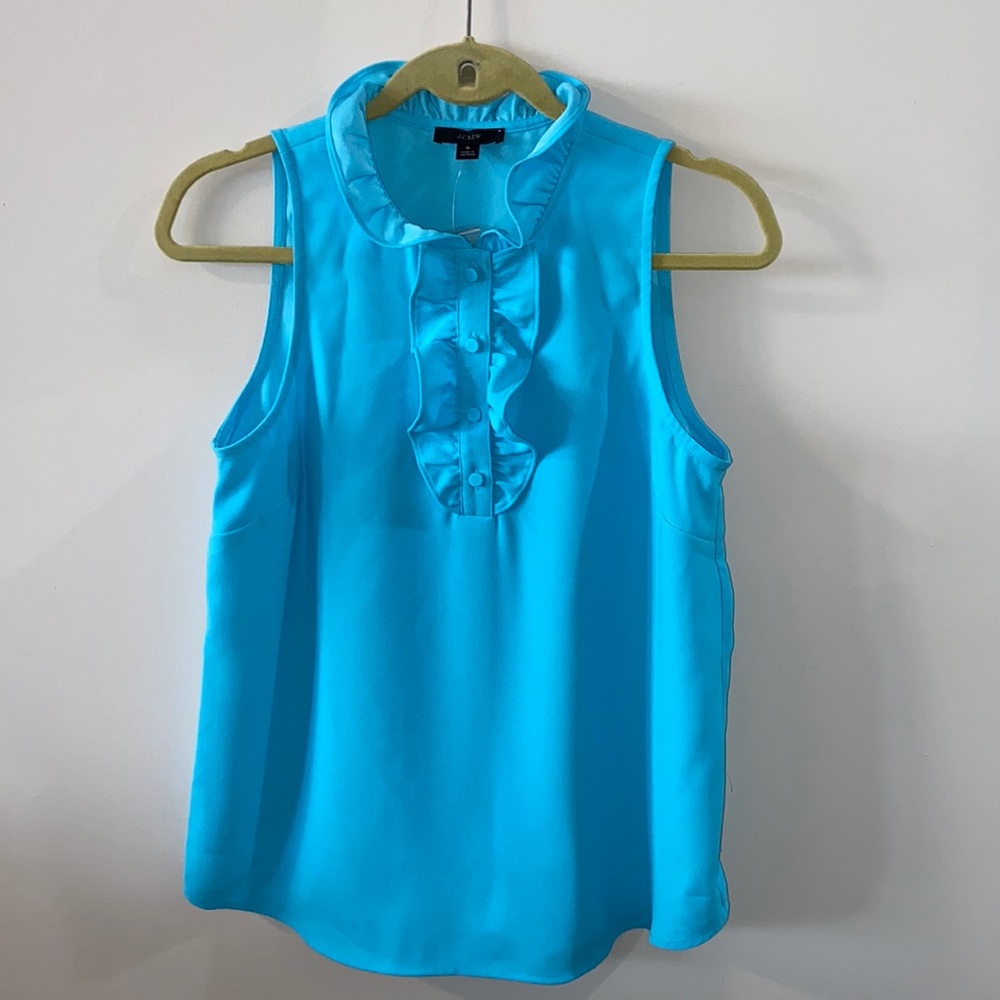 J Crew sleeveless blouse. New with tags & extra button. Size small.